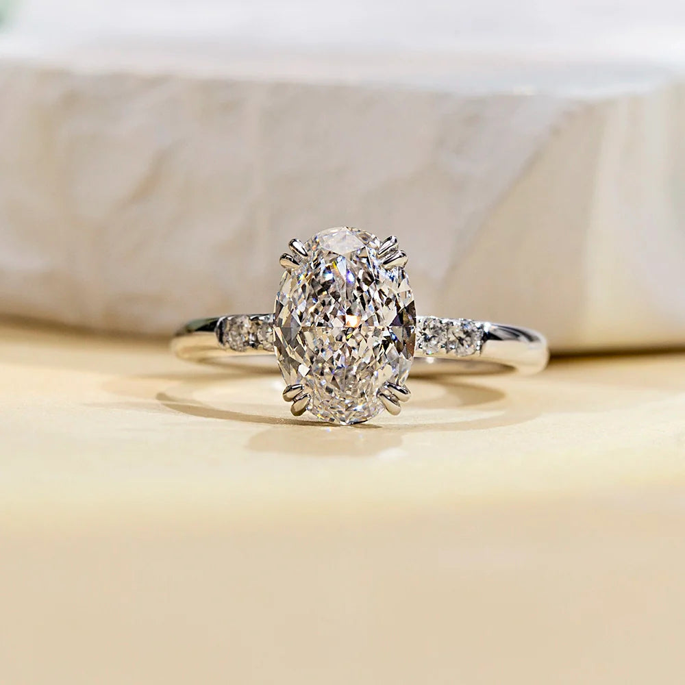 Hidden Halo Oval Solitaire With Cluster Side Stones (2 CT)