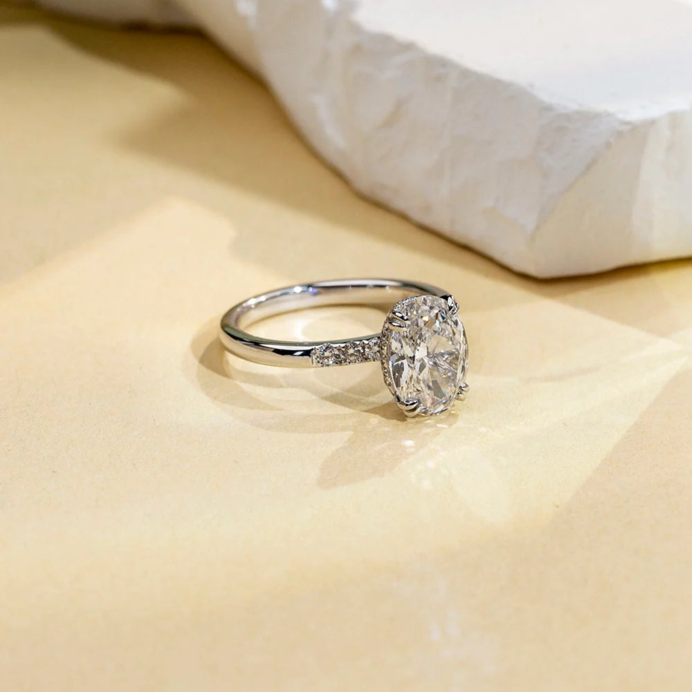 Hidden Halo Oval Solitaire With Cluster Side Stones (2 CT)