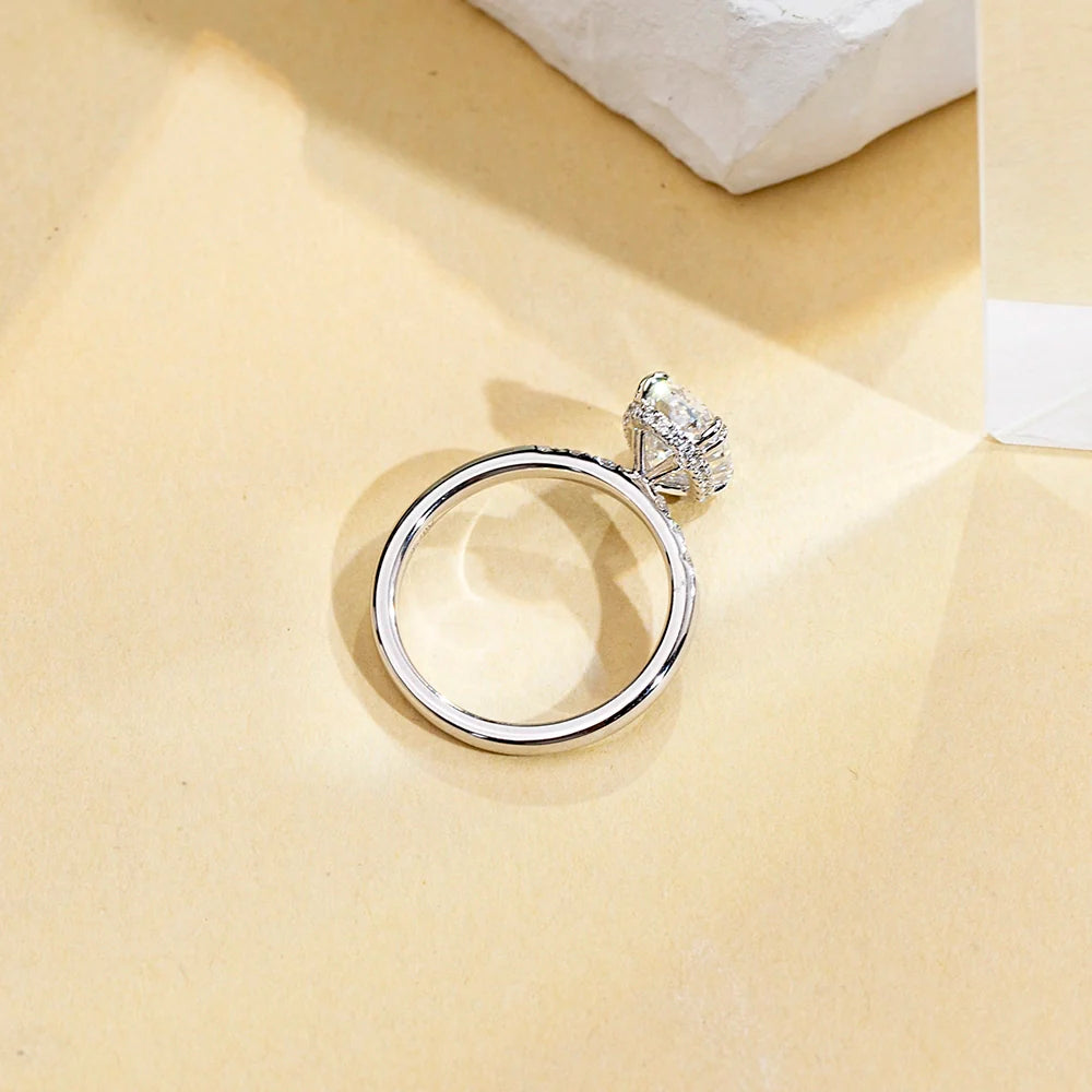 Hidden Halo Oval Solitaire With Cluster Side Stones (2 CT)