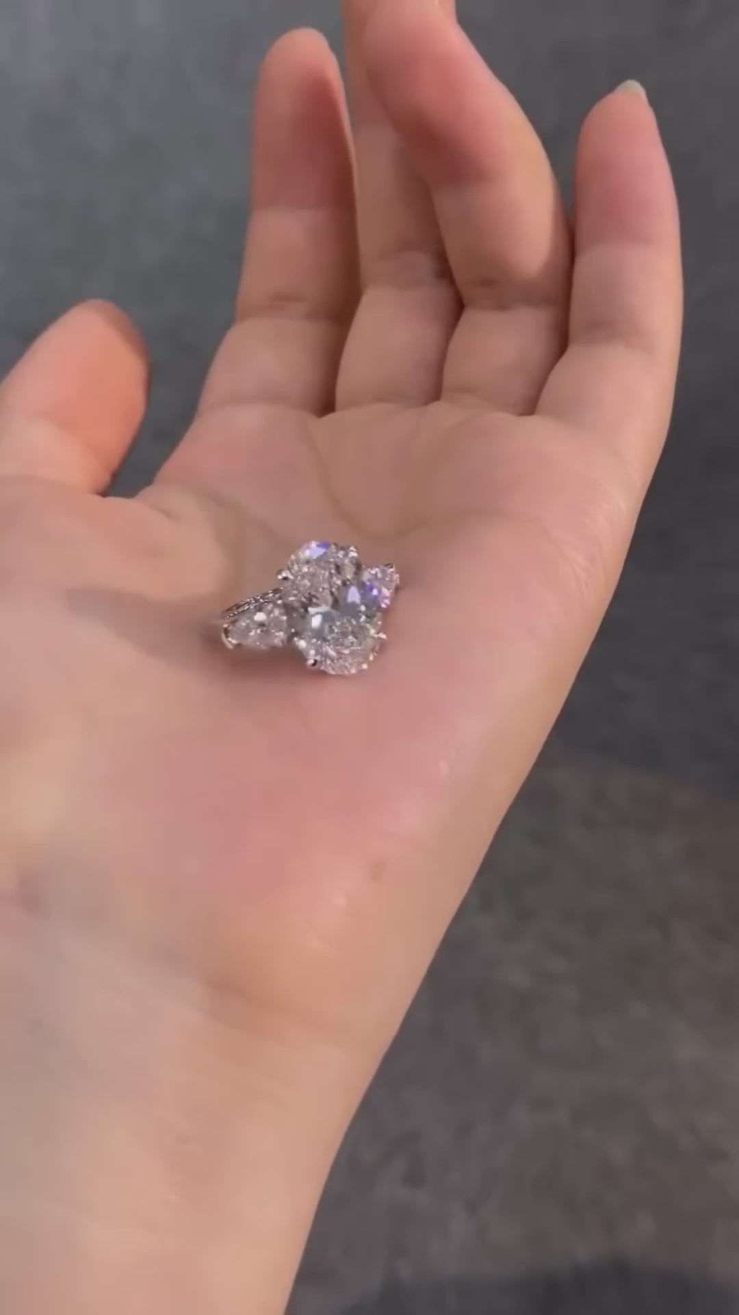 Oval Engagement Ring with Pear-Shaped Side Stones (1.5 CT)